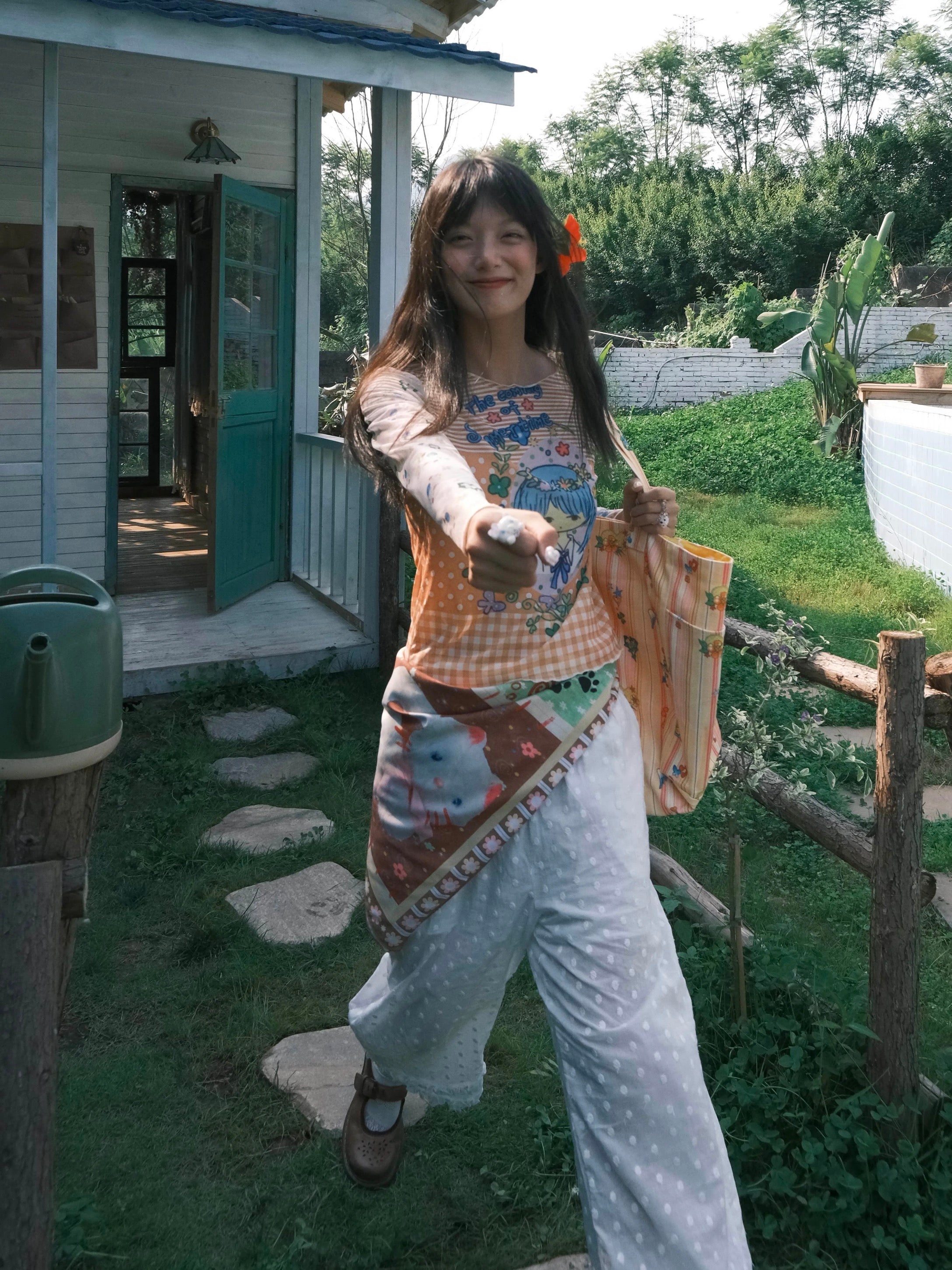 Orange mesh top with a girl print