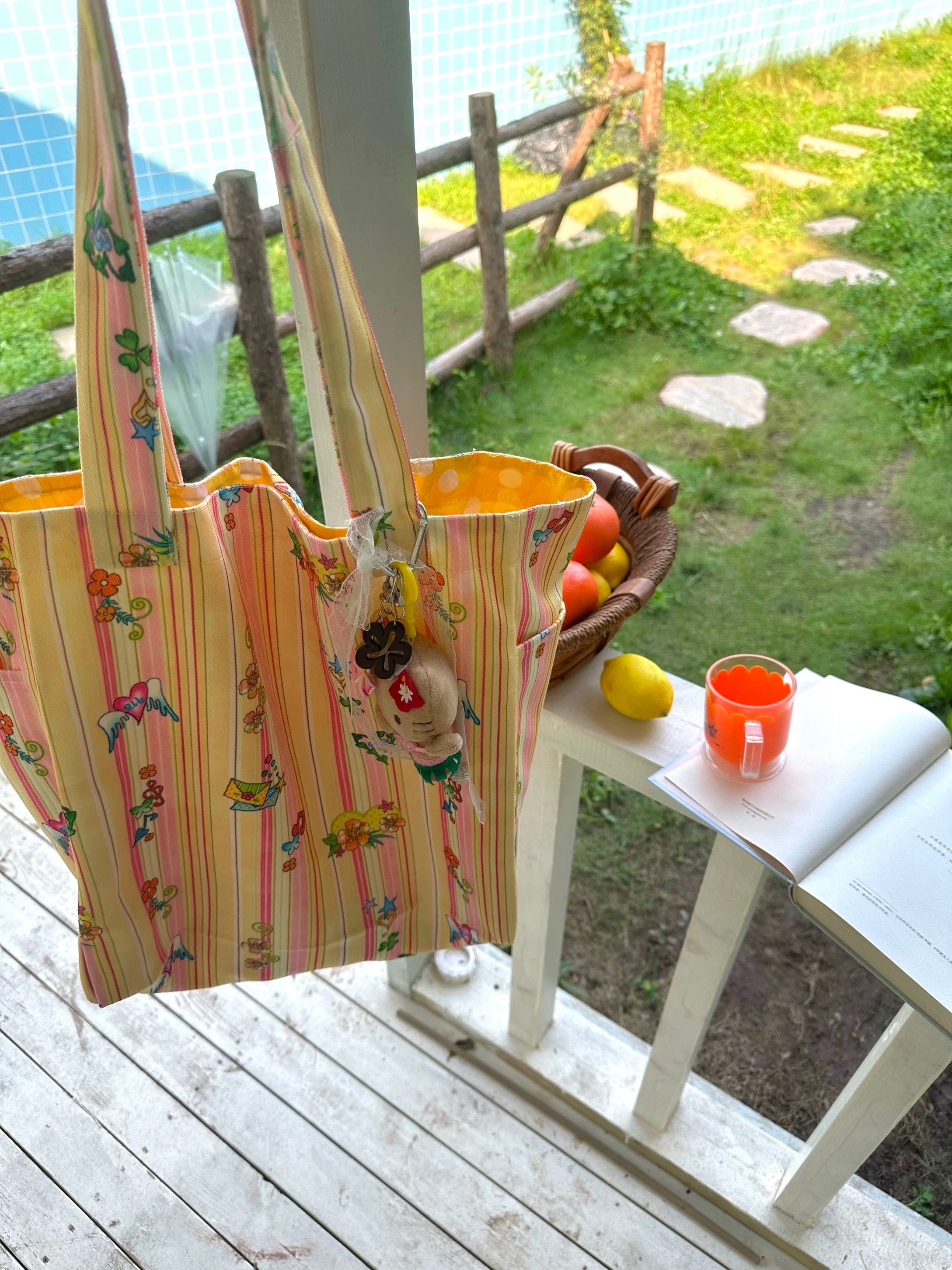Orange printed canvas shoulder bag