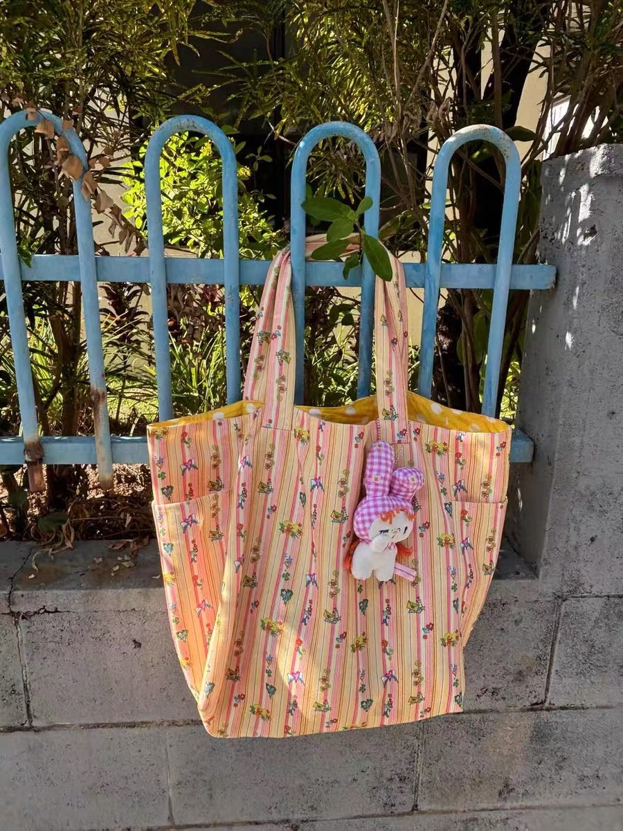 Orange printed canvas shoulder bag