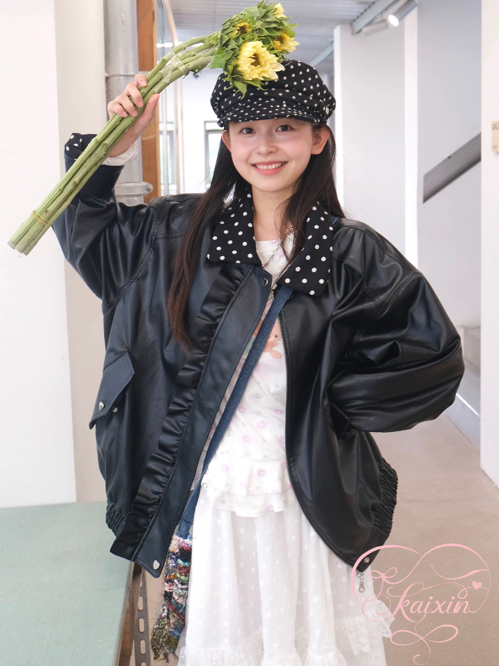 Black leather jacket with polka-dot collar and lace trim