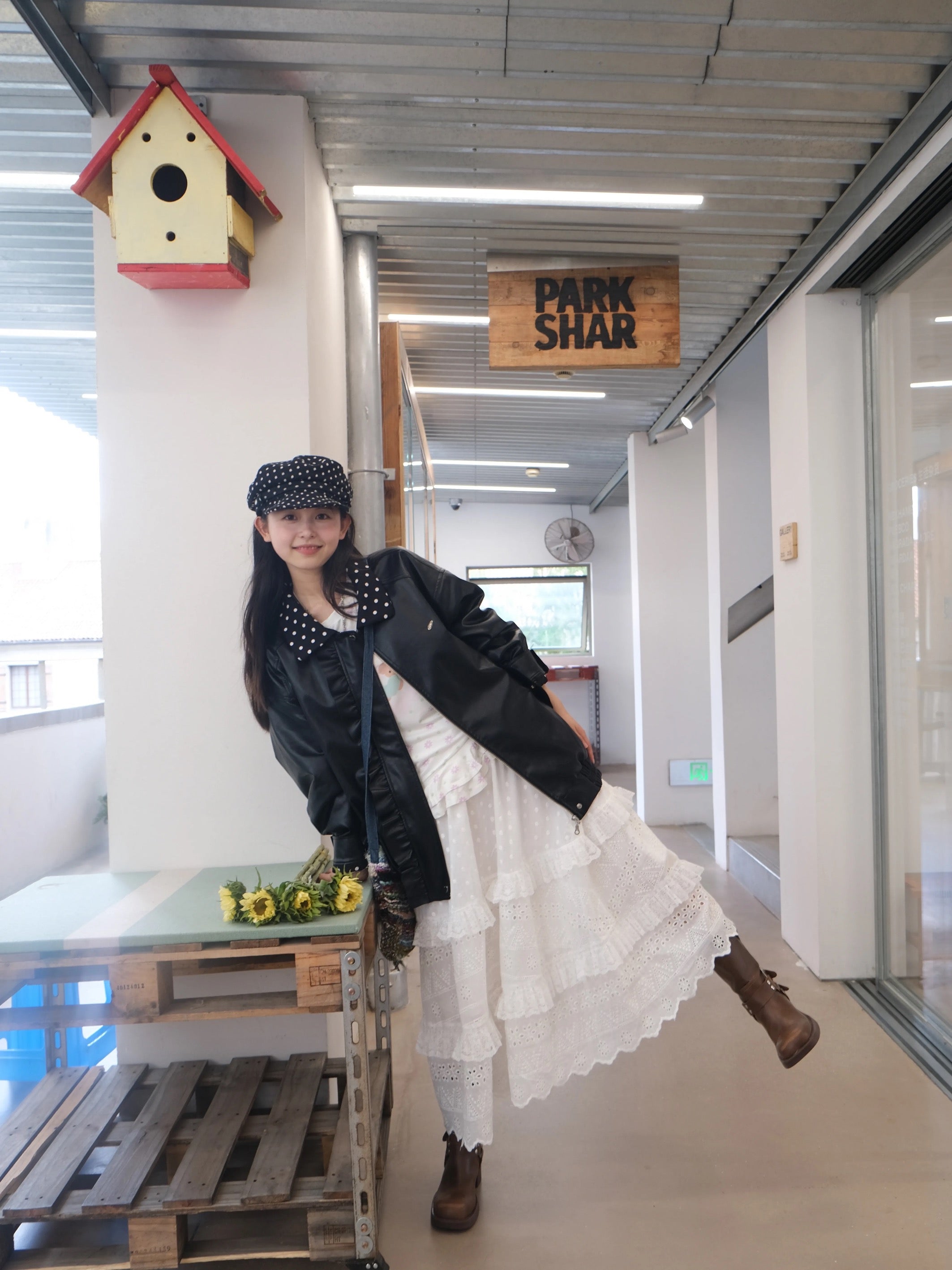 Black leather jacket with polka-dot collar and lace trim