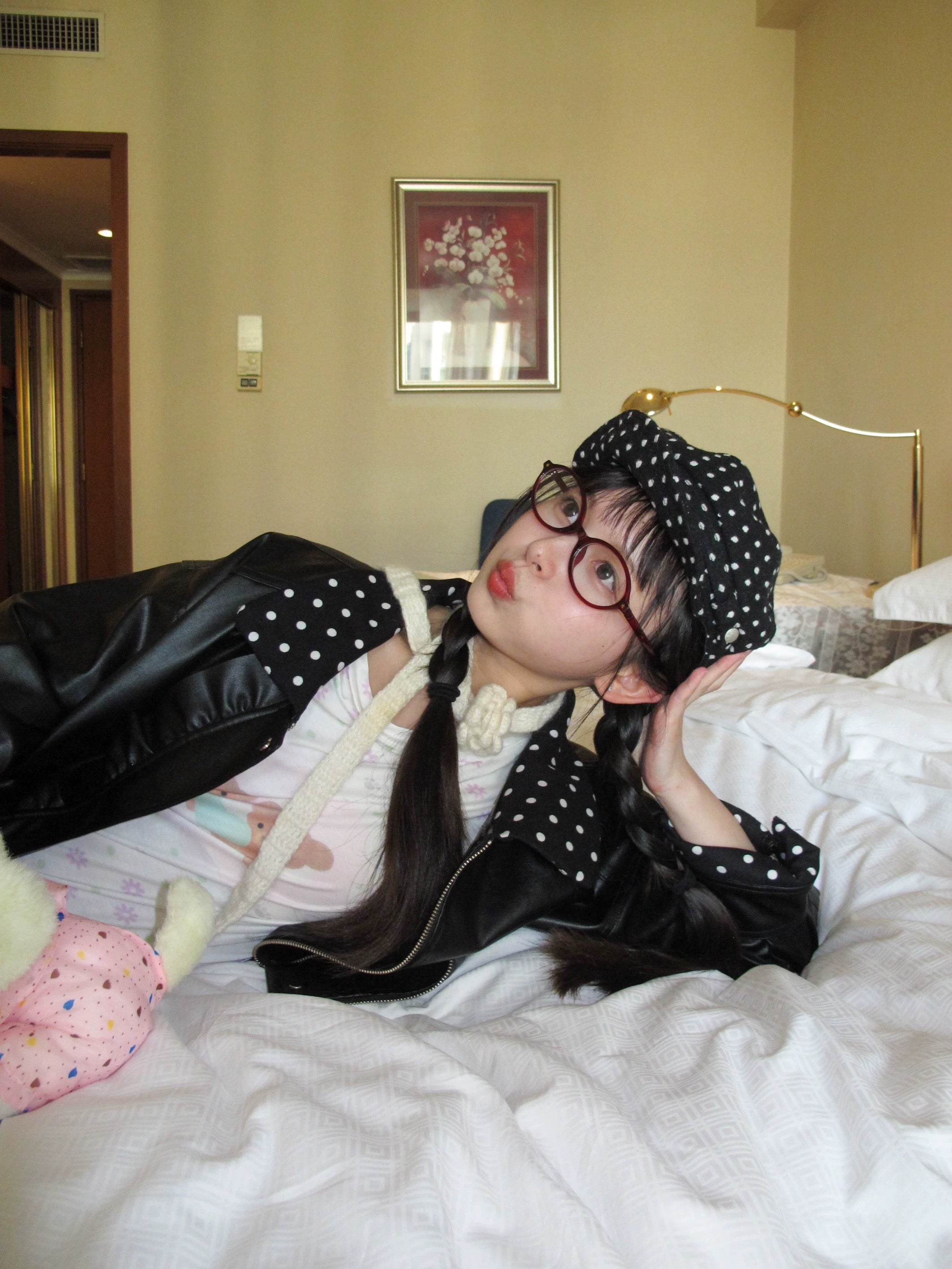 Black leather jacket with polka-dot collar and lace trim